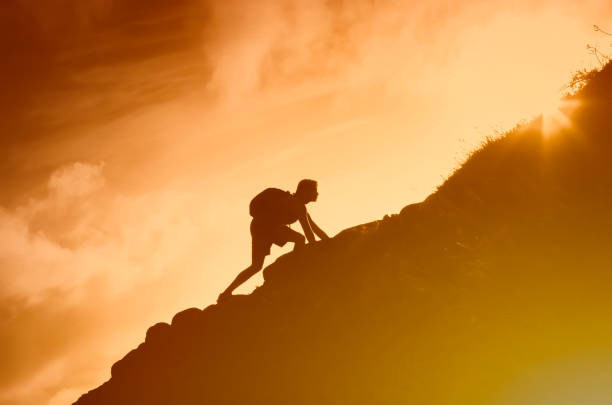 Mountain hiker at sunset